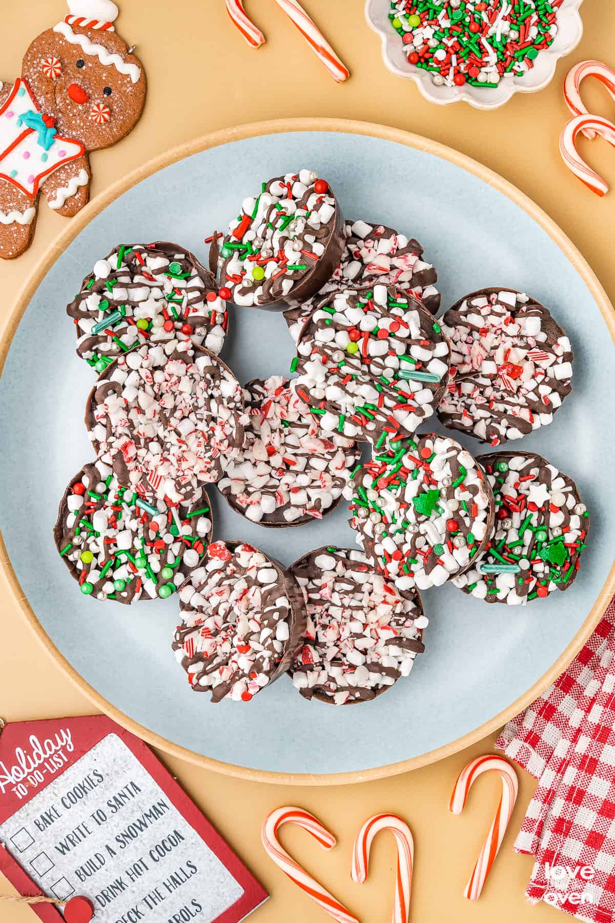 Hot Chocolate Bomb Cups spread on a blue plate.