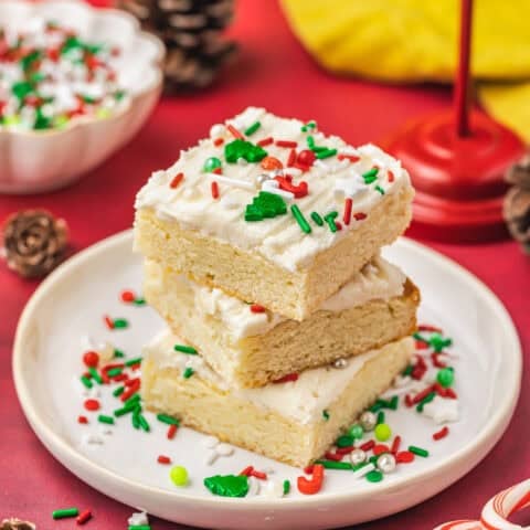 A stack of christmas sugar cookie bars on a plate