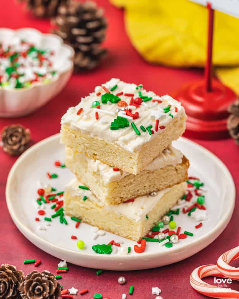 A stack of christmas sugar cookie bars on a plate