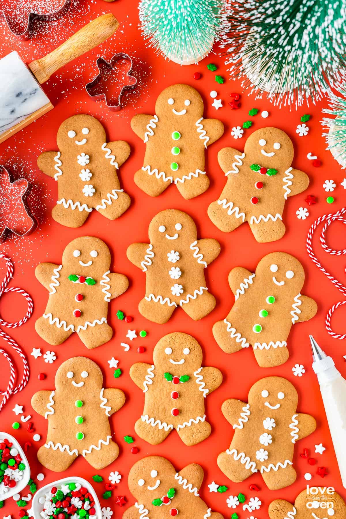 Christmas gingerbread man cookies on a red background.