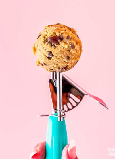 A cookie scoop full of cookie dough
