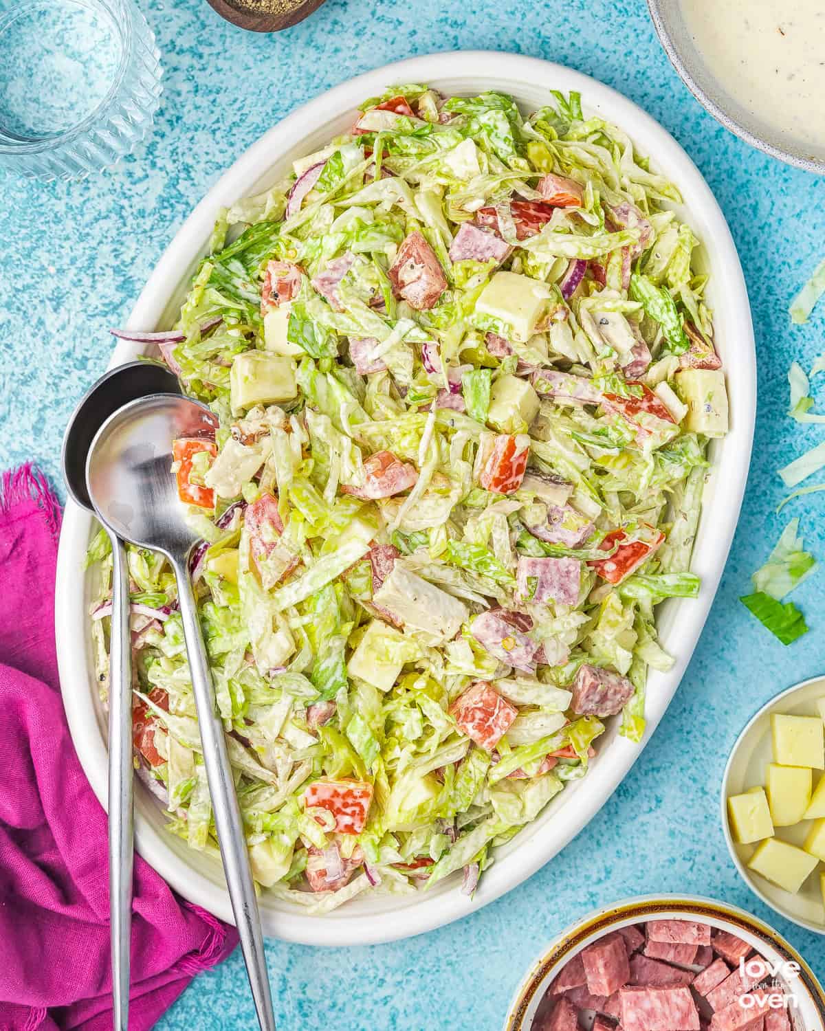 Grinder Salad on a plate with serving spoons