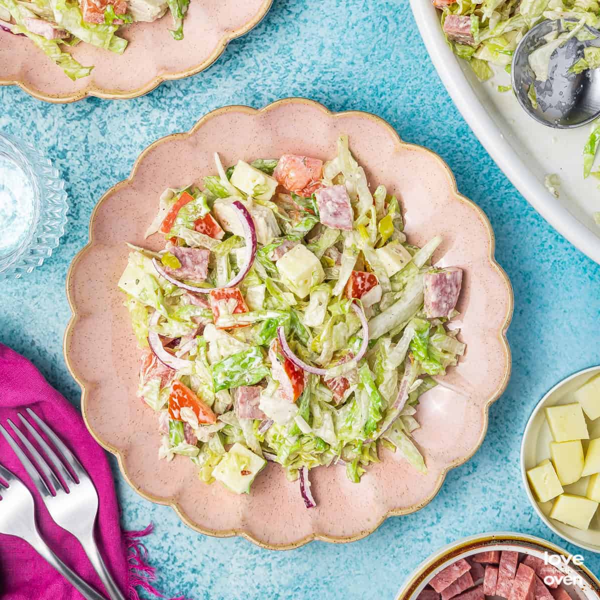 Grinder Salad on a pink plate