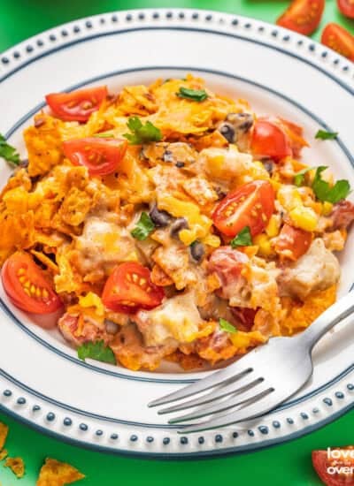 A plate of Doritos chicken casserole with a fork