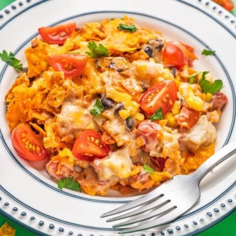 A plate of Doritos chicken casserole with a fork
