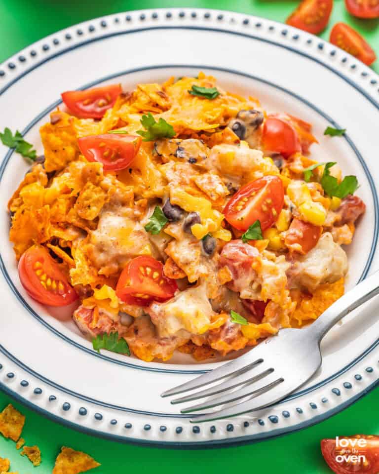A plate of Doritos chicken casserole with a fork