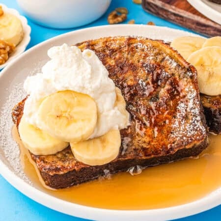 Banana bread French toast on a plate with syrup