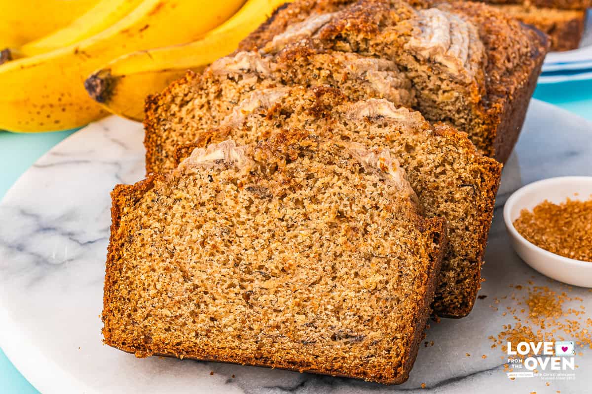 brown butter banana bread slices lined up on a plate