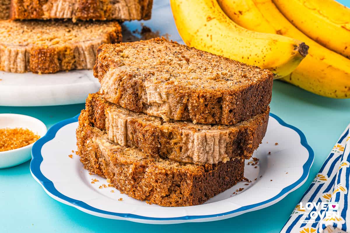 a stack of brown butter banana bread slices on a plate