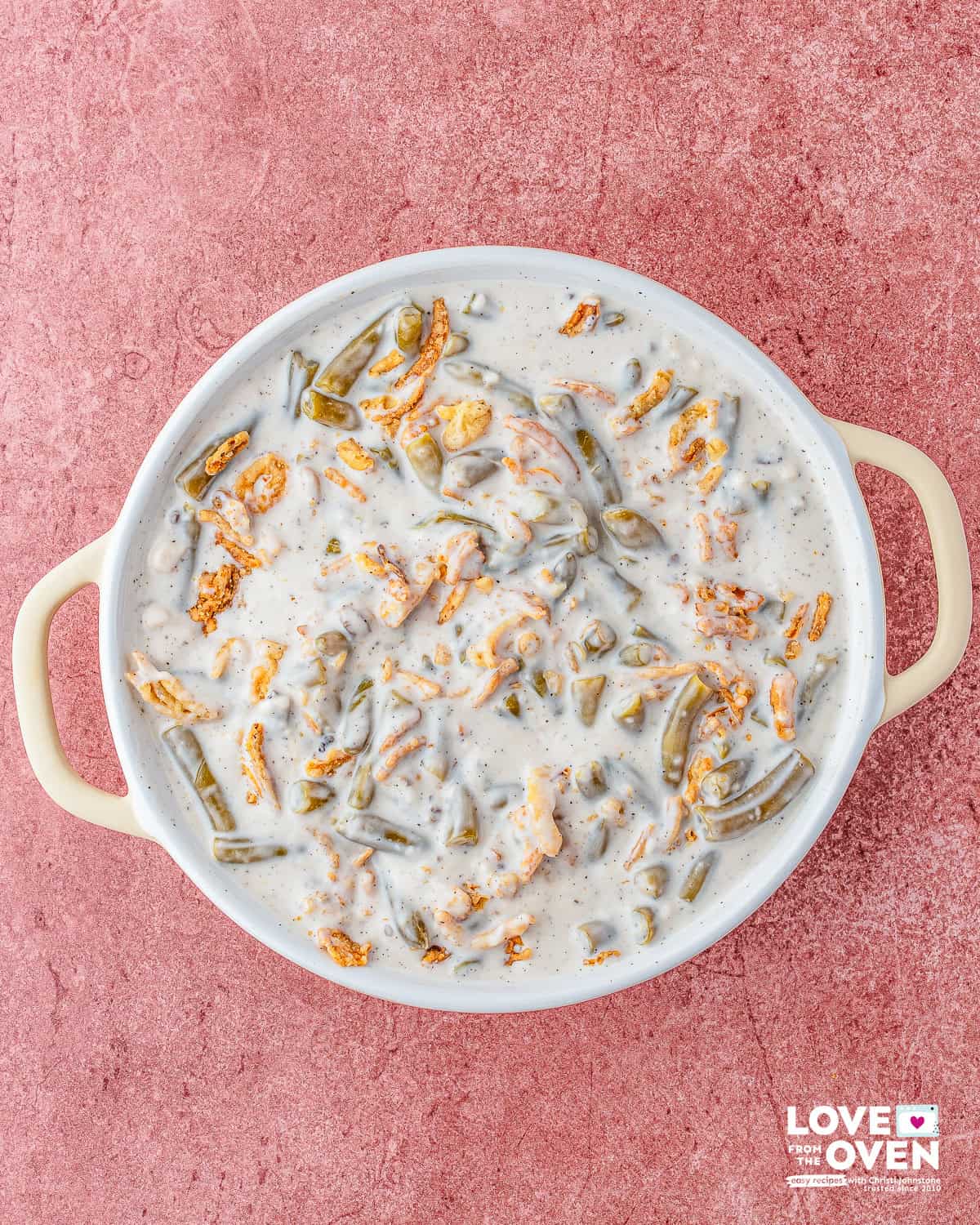 Campbell's Green Bean Casserole filling ingredients in a baking dish