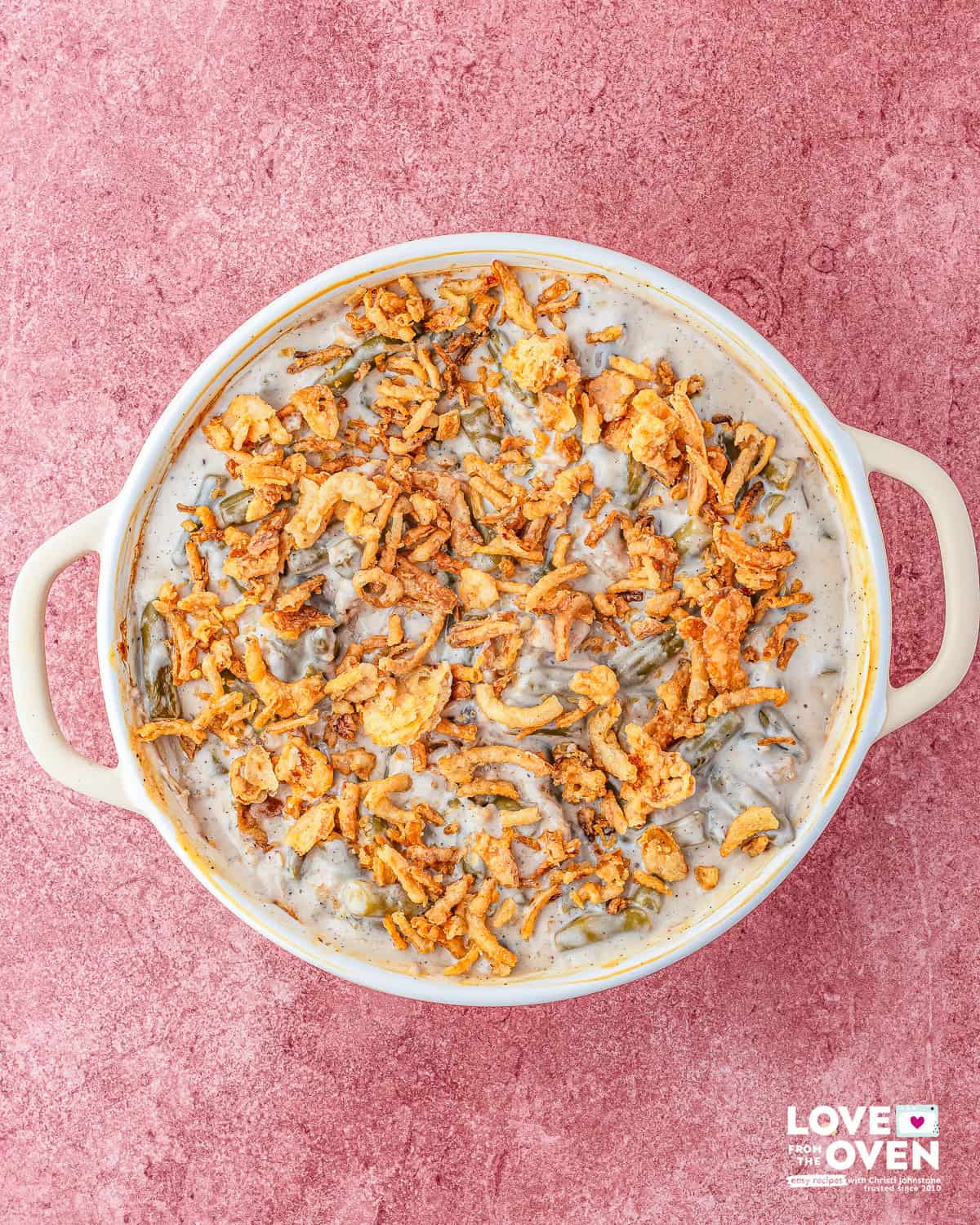 Campbell's Green Bean Casserole filling ingredients topped with crispy onions